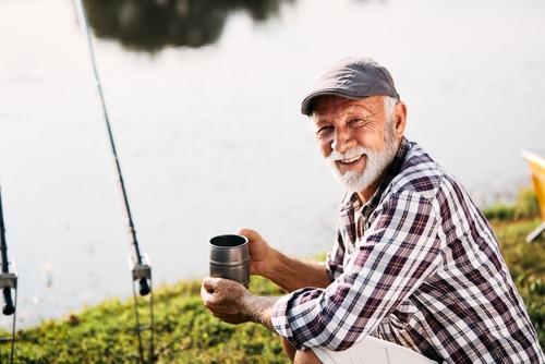 Senior with eye exam tool, demonstrating precision in cataract detection