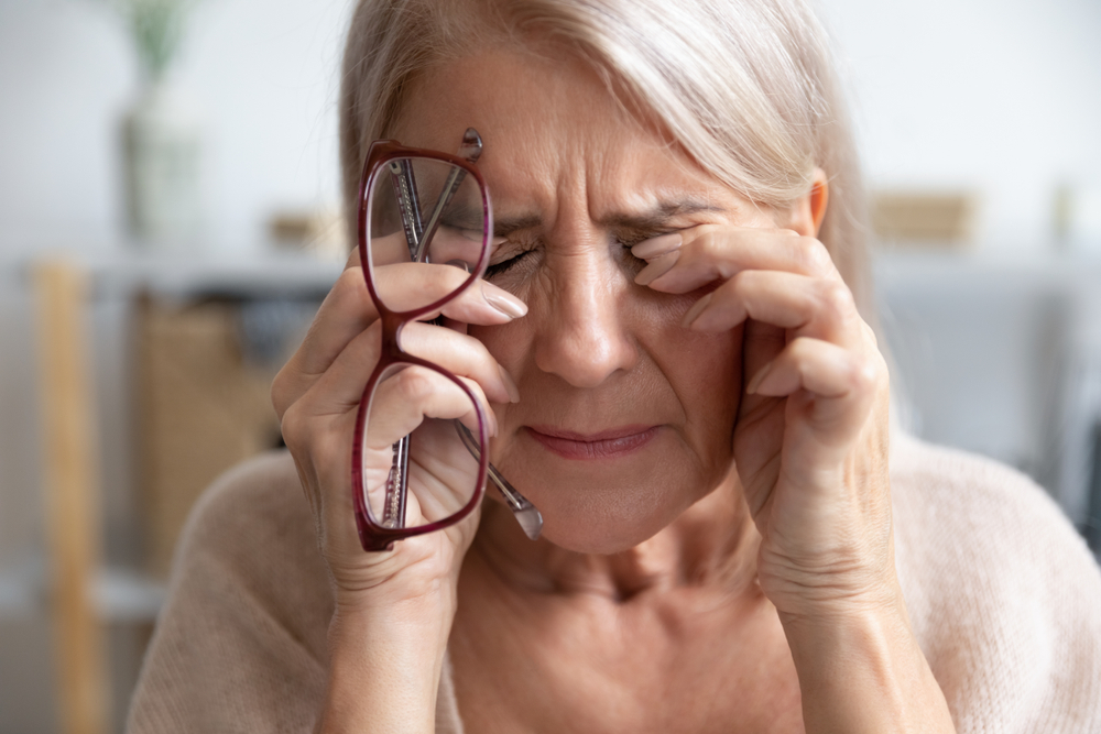 Happy senior woman smiling with clear gaze, celebrating improved eyesight post-procedure