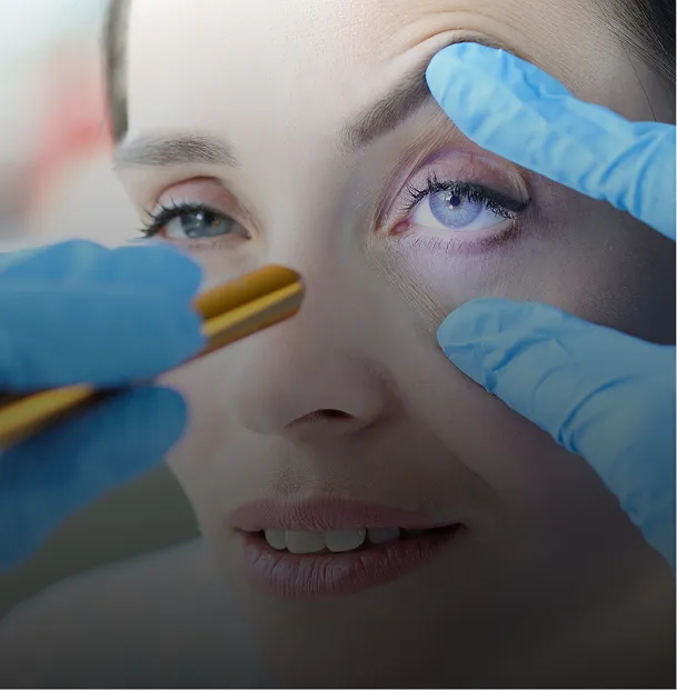 Woman has eyes checked during an eye exam.