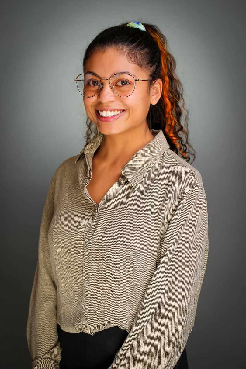 Laura smiling in glasses. Desert Vision Center team member supporting optometry visits and patient care.