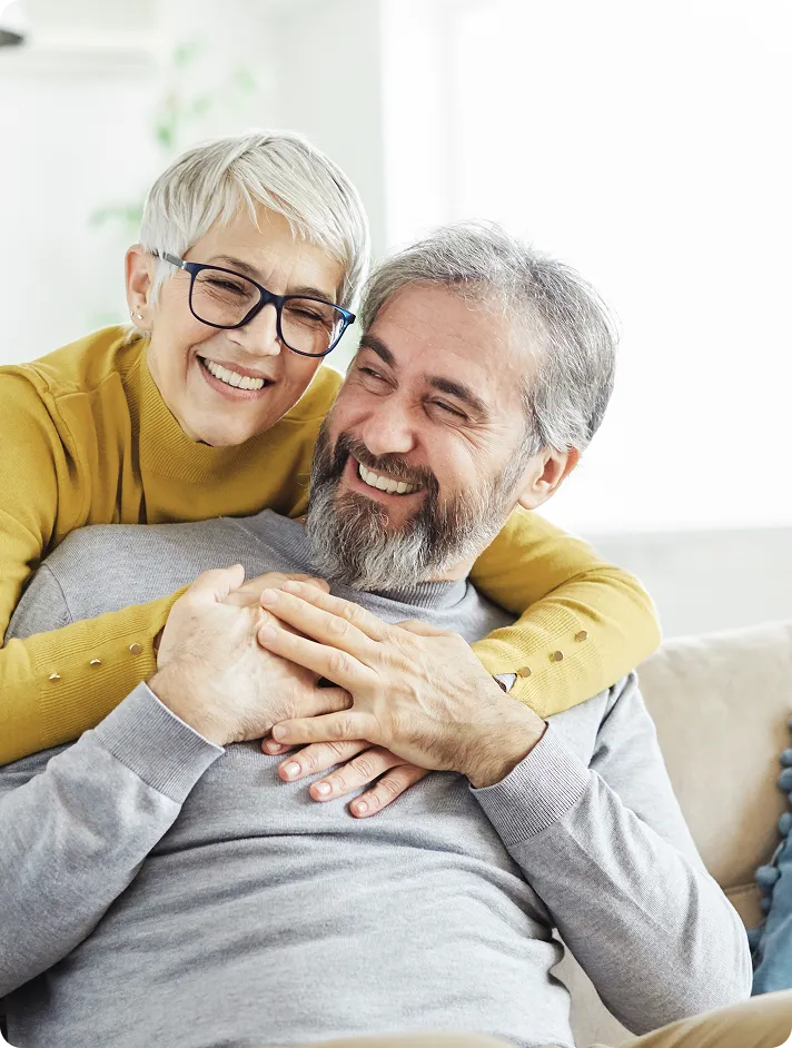 A senior couple who received an advanced diagnostic exam to assess their eye health.
