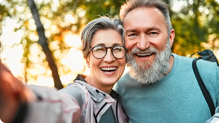 A senior couple with clear vision enjoy the outdoors.