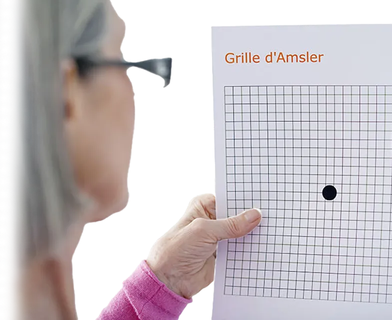 Woman using Amsler Grid to test for macular degeneration.